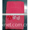 TOWEL WITH EMBROIDERED PATTERN