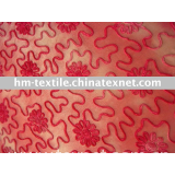 red coiling embroidery fabric